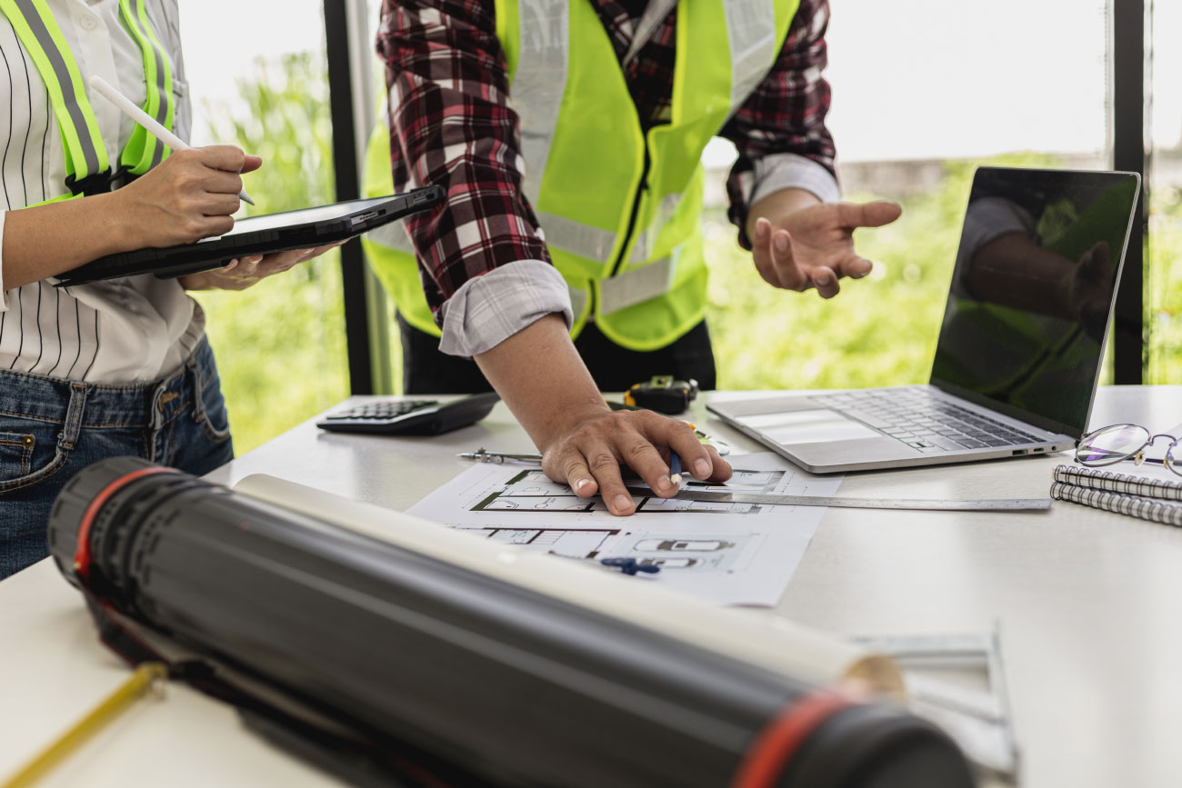 Constructions workers looking at blueprints